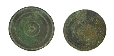 Lot 379 - A Bronze Disc Mirror, in 1st century Roman...