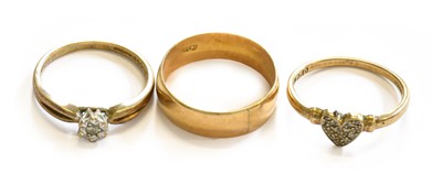 Lot 213 - Three Rings, comprising of a band ring,...