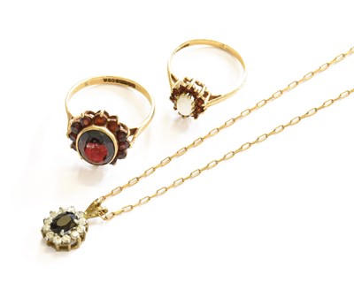 Lot 210 - A 9 Carat Gold Garnet Cluster Ring, finger...