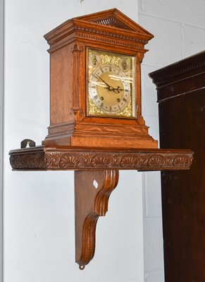 Lot 1247 - A German Oak Cased Chiming Table Clock, with...