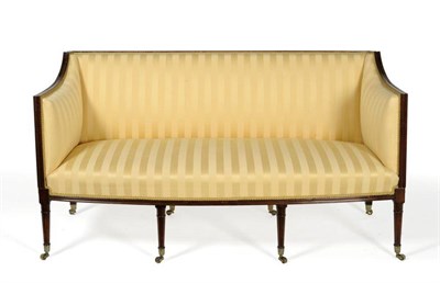 Lot 1278 - A Late George III Mahogany Framed Sofa, circa 1820, recovered in yellow striped silk damask,...