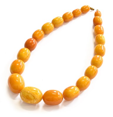 Lot 315 - A Graduated Amber Bead Necklace, length 54cm