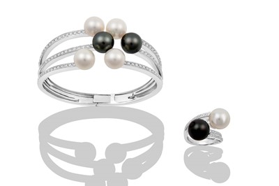 Lot 2325 - A Cultured Pearl and Diamond Bangle and Ring...