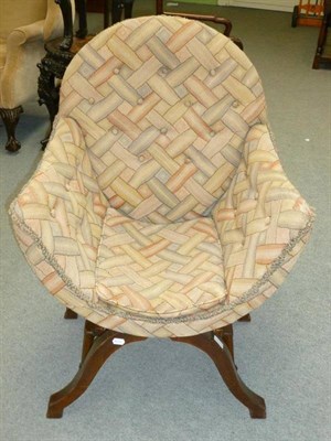 Lot 1280 - A Queen Anne Walnut Cross Framed Armchair, recovered in multi-coloured moquette, with curved...