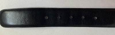 Lot 5029 - Gucci Black Leather Belt, stamped in gilt to...