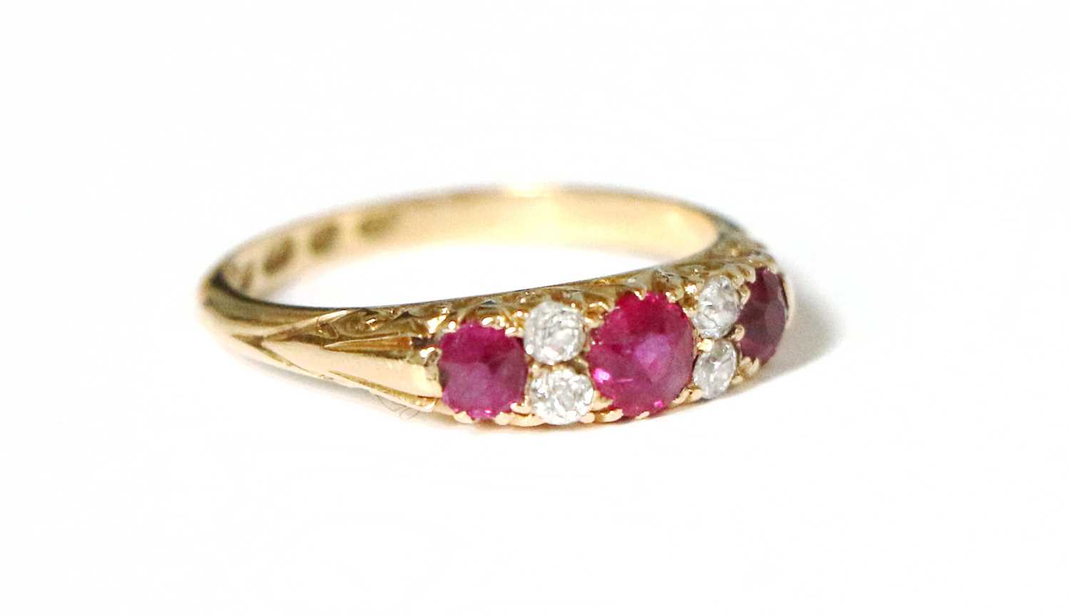 Lot 52 - An 18 Carat Gold Synthetic Ruby and Diamond...
