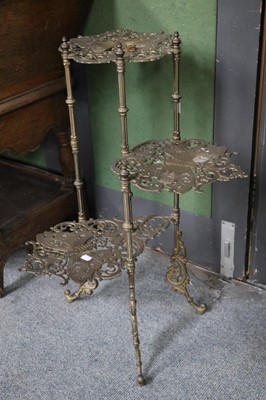 Lot 1105 - A Victorian Brass Three-Tier Stand, decorated...