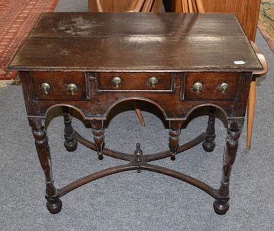 Lot 1346 - An Oak Lowboy, 18th century, the turned legs...