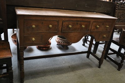 Lot 1159 - An Oak Dresser Base, 18th century, of small...