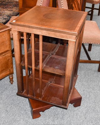 Lot 1327 - A Reproduction Crossbanded Revolving Bookcase,...