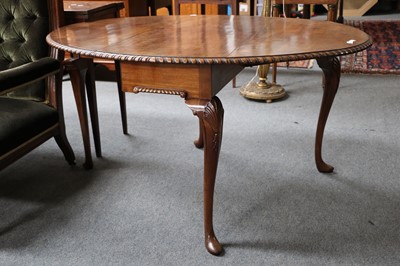 Lot 1144 - An early 20th century Dropleaf Table, on shell...