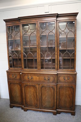 Lot 1245 - A Reproduction Mahogany Breakfront Bookcase,...