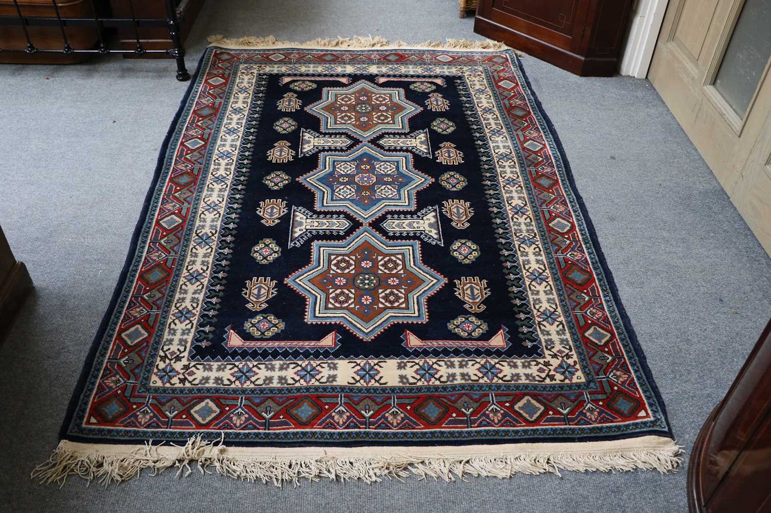 Lot 1016 - A North-West Persian Rug, the indigo field...