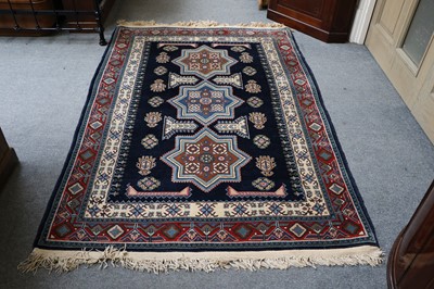 Lot 1016 - A North-West Persian Rug, the indigo field...