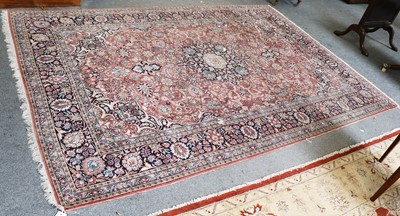 Lot 1018 - A Kashmir Silk Carpet, the coral pink field of...