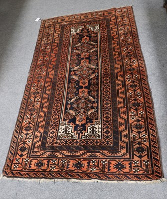 Lot 1020 - A Baluch Rug, the field with a row of diamond...