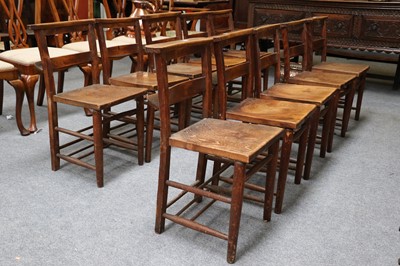 Lot 1167 - A Set of Ten Oak and Elm Chapel Chairs