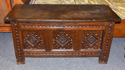 Lot 1285 - A Carved Oak Three Panel Coffer, 18th century,...