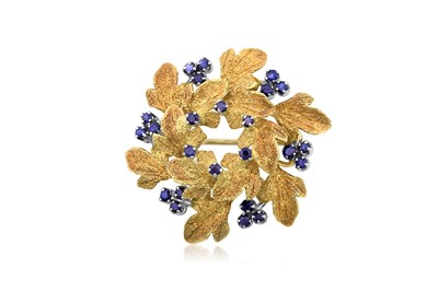 Lot 2383 - An 18 Carat Gold Sapphire Brooch two circular...