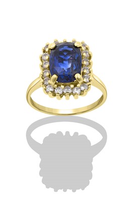 Lot 2293 - A Sapphire and Diamond Cluster Ring the oval...