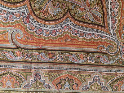 Lot 2133 - Circa 1870 Large Woven Paisley Shawl, on a red...