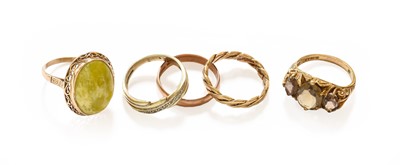 Lot 44 - Five Rings Comprising, a 9 carat gold textured...