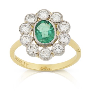 Lot 2244 - An Emerald and Diamond Cluster Ring