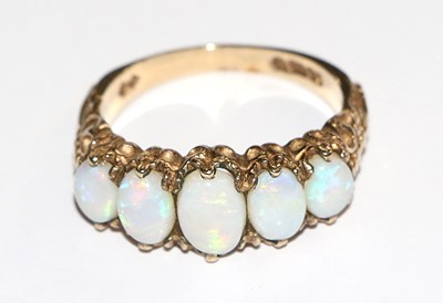 Lot 91 - A 9 Carat Gold Opal Five Stone Ring, the...
