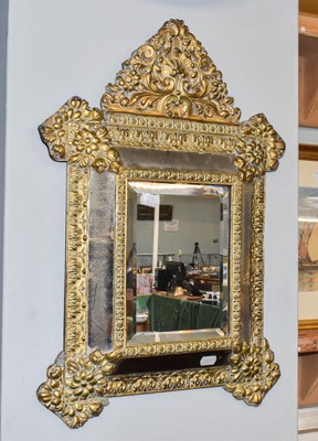 Lot 1181 - A Brass Mounted Cushion Shaped Pier Glass,...