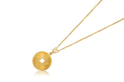 Lot 2302 - A Pendant on Chain the textured yellow disc...