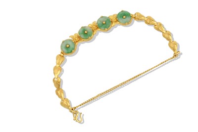 Lot 2301 - A Jade Bracelet four jade discs with a central...