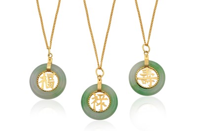 Lot 2294 - Three Jade Pendants on Chains jade discs with...