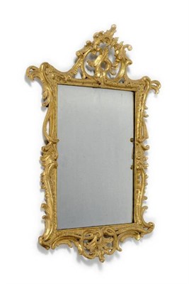 Lot 1292 - A George II Carved Giltwood Rococo Wall Mirror, mid 18th century, the rectangular plate within...