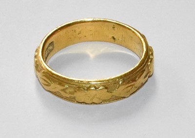 Lot 53 - A Textured Band Ring, indistinctly marked,...