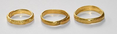 Lot 56 - Three Textured Band Rings, with expanding...