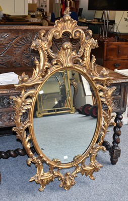 Lot 1121 - A Reproduction Gilt Framed Oval Wall Mirror,...