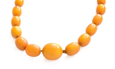 Lot 23 - A Graduated Amber Bead Necklace, length 41cm...