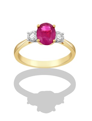 Lot 2321 - An 18 Carat Gold Synthetic Ruby and Diamond...