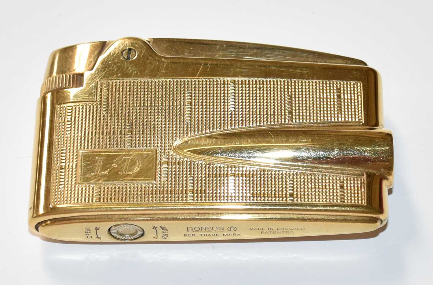 Lot 108 - A Ronson 9ct Gold Table Lighter, with engine