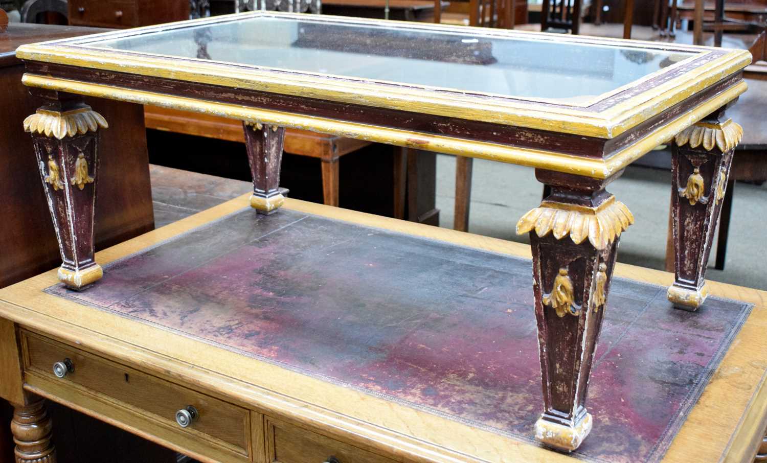 Lot 1253 A Painted Glass Top Coffee Table, raised on