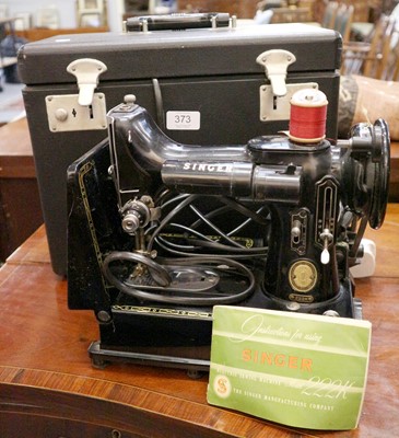 Lot 373 - A Singer Sewing Machine, model 222K in case