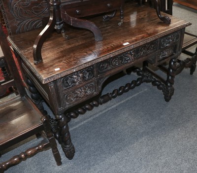 Lot 1161 - A Late Victorian Oak Desk, heavily carved in...