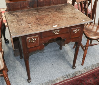 Lot 1166 - A Mid-18th Century Oak Three Drawer Lowboy,...