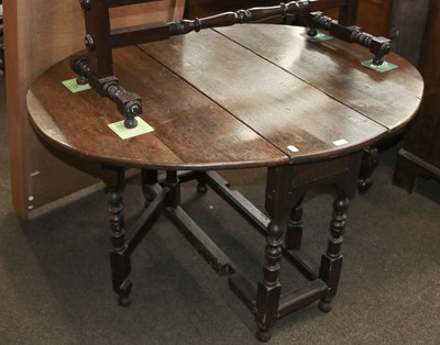 Lot 1207 - An 18th Century Oak Gateleg Table, with turned...