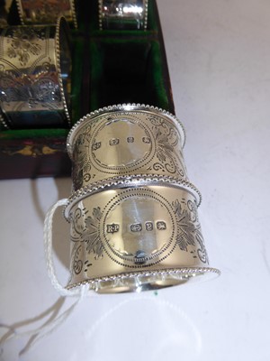 Lot 2113 - A Cased Set of Six Victorian Silver Napkin-Rings