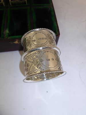 Lot 2113 - A Cased Set of Six Victorian Silver Napkin-Rings