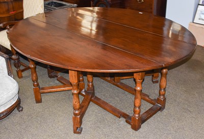 Lot 1230 - A Reproduction Oak Wake Table, in the manner...