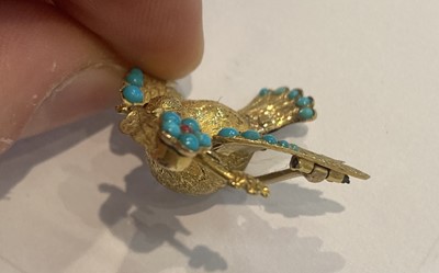 Lot 32 - A Turquoise and Ruby Dove Brooch, unmarked,...