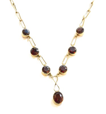 Lot 111 - A 9 Carat Gold Garnet Necklace, drop length...