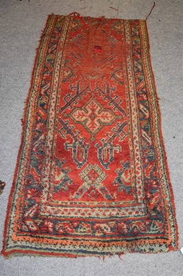 Lot 1164 - An Afghan Rug, the faded raspberry field with...